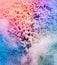 Pastel colorful holi powder frozen in explosion.