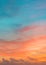 Pastel colors ocean sunset, warm and cyan clouds sky