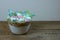 Pastel colour easter eggs with flowers in basket