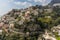 Pastel coloured buildings and the road snaking its way down the hillside in Positano on the Amalfi coast, Italy