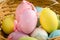 Pastel Coloured Easter Eggs in a Straw Basket