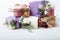 Pastel colours carton bithday gift boxes with ribbon and flowe