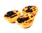 Pastel de Nata - creamy sweet curstard with black crust and sugar powder isolated on white. Pasteis de Belem egg tart