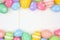 Pastel Easter Egg double border against a white wood background