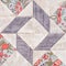 Pastel geometric patchwork block from pieces of fabrics, detail of quilt, close-up