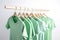 Pastel green shirts store rack. Generate ai