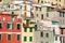 Pastel houses of Riomaggiore, the largest of the five centuries-old villages of Cinque Terre, Italian Riviera, Liguria, Italy