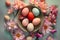 Pastel hued Easter eggs surrounded by fresh, colorful blooms