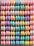 Pastel ombre macaroons perfectly arranged, flat lay, AI generated