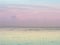 Pastel peaceful scene of a calm ocean sea and sunset sky