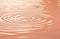 Pastel peach color rippling water reflections, beige abstract background, Peach Fuzz