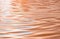 Pastel peach color rippling water reflections, Peach Fuzz