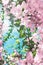 Pastel pink blooming flowers and blue sky in a dream garden, floral background