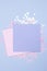 Pastel pink and blue blank cards mockup and blue background with scattered glitter stars. Space for your text