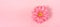 Pastel pink festive minimal banner with one gerbera flower and copy space for text