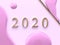 Pastel pink flat lay minimal scene gold 2020 number text/type 3d rendering