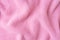 Pastel pink knitwear wool fabric texture background. Abstract textile backdrop
