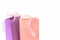 Pastel pink and lilac colorful shopping bags isolated