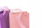 Pastel pink and lilac colorful shopping bags tops closeup