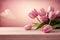 pastel pink monochromatic bouquet of tulips on a wooden surface and pink background. elegant floral backdrop wallpaper for mothers