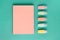 Pastel school supplies, notebook and markers on mint background. Top view, flat lay, frome above. Back to school