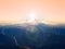 Pastel sky above mountain peak - aerial overhead view