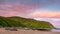 A pastel sunset over the Rosetta Bluff from the beach at Petrel Cove located on the Fleurieu Peninsula Victor Harbor South