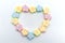 Pastel sweet flowers shape of marshmallows. Heart design for copy space