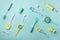 Pastel yellow, blue cooking utensils on turquoise background. Food ingredients. Cooking cakes and baking bread concept