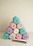 Pastell coloured woolen balls and colorful crochet hooks for crocheting and handicraft