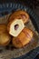 Pasticciotto leccese pastries on a dark blue plate on dark table close up