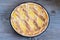 Pastiera napoletana, the traditional Easter cake from Naples on wooden table