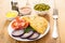 Pasties, red onion, dill, tomatoes, bowls with sauces, green pea