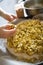 Pastilla filling preparation with chicken spreaded by hands