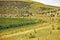 Pastoral in the crater of an extinct volcano. The emerald round Lake Nar is surrounded by green reeds.