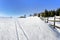 A Pastoral Scene Of Snow Covered Fences