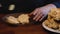 Pastry being prepared to eat on a wooden table