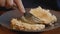 Pastry being prepared to eat on a wooden table