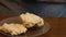 Pastry being prepared to eat on a wooden table