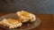 Pastry being prepared to eat on a wooden table