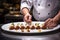 pastry chef arranging cannoli on a dish