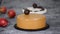 Pastry chef decorating the cake with chocolate apples and leaves. Pastry chef decorated Modern european cake.