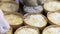 Pastry chef hands sprinkling sugar powder on dough for easter sweet bread