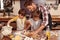 Pastry chefs in the making. Two cute little boys baking with their father in the kitchen.