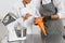 Pastry chefs preparing cream at table in kitchen