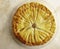 Pastry dough Galette des Rois with cream frangipane with almond
