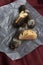 Pastry filled with cream, traditional french eclairs with chocolate on wooden table, selective focus