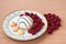 Pastry with raspberries on a white plate. Ripe berries