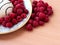 Pastry with raspberries on a white plate. Ripe berries