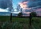 Pasture fence with colorful sunset